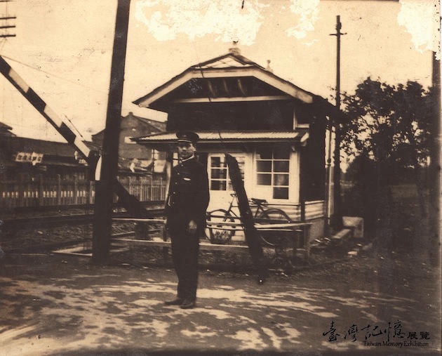 Railway Worker at a Railroad Crossing